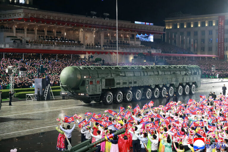 North Korea displays new long-range missile at a military parade celebrating Kim Jong Un