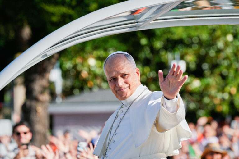 1 million people flood Madrid streets to see the pope’s flower-carpeted procession