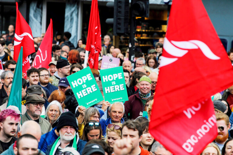 Thousands rally in Belfast to condemn anti-immigrant rioting that followed stabbing